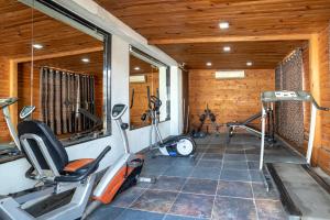 a gym with two exercise bikes in a room at Spree Hotel Jaipur in Jaipur