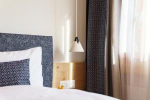 Rúm í herbergi á Gstaaderhof - Active & Relax Hotel