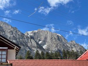 a view of the mountains from a house at Casa Iancu in Buşteni