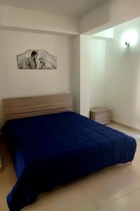 Monticelli Casa Vacanza tesisinde bir odada yatak veya yataklar