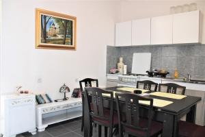 a kitchen with a table and chairs in it at Apartment Dora in Neum