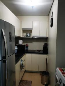 Küche/Küchenzeile in der Unterkunft New Paradise Ocean View Apartment (DOT accredited)