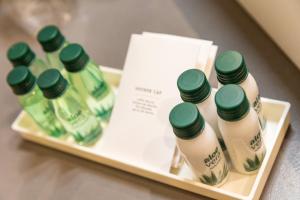 a tray with five bottles of milk on a table at Grand Hotel Park in Dubrovnik