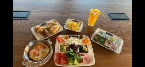 a table with four trays of food and a drink at SPARK HOTEL RESIDENCE KONYA in Yazır