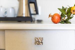 a counter top with a bowl of fruit on it at Grand Hotel Park in Dubrovnik