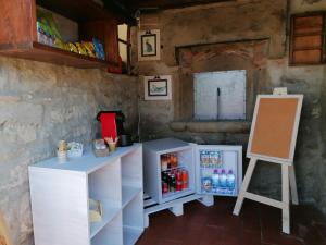 a room with a refrigerator and a chalk board at Agriturismo Poggio all'Olmo in Greve in Chianti
