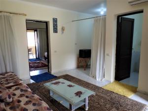 Un pat sau paturi într-o cameră la Stella Makadi Palace Chalet