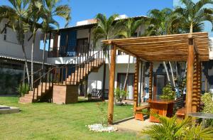 a resort with a staircase and a building at Villa Atalaia in Aracaju