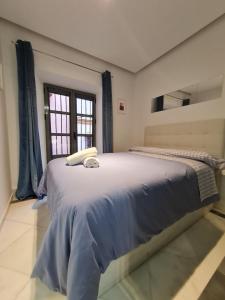 Cama o camas de una habitación en DreamsApt Sierpes