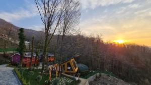 an aerial view of a house with the sunset in the background at Sapanca Casamia Suit in Sapanca