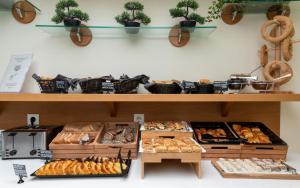 a bakery with lots of different types of pastries at Hotel Hermes in Rhodes Town