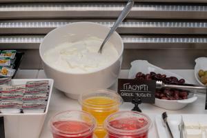 a counter with a bowl of yogurt and other ingredients at Hotel Hermes in Rhodes Town