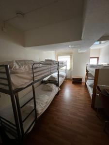 Postel nebo postele na pokoji v ubytování Arkadia Hotel & Hostel