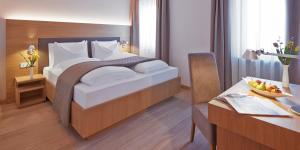 Posteľ alebo postele v izbe v ubytovaní Hotel Post Gries
