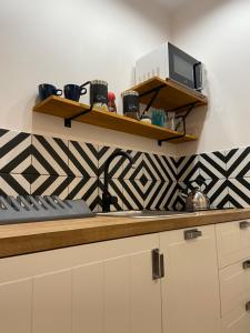 Kuchyňa alebo kuchynka v ubytovaní APARTAMENT WILEŃSKA #free parking, self check-in + 10 fotografií