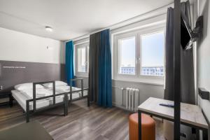 Postel nebo postele na pokoji v ubytování a&o Dresden Hauptbahnhof + 35 fotografií