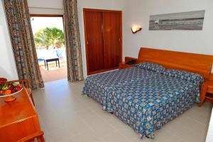 Cama ou camas em um quarto em Hotel Ca Marí