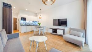 TV a/nebo společenská místnost v ubytování Sunset Resort, Sun & Snow