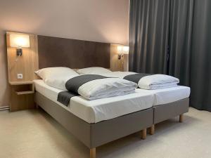 Postel nebo postele na pokoji v ubytování Hana Aparthotel