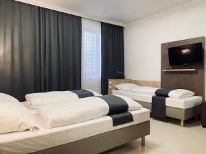 Postel nebo postele na pokoji v ubytování Hana Aparthotel