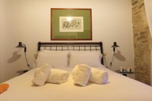 A bed or beds in a room at Sete Artes by Como en Casa