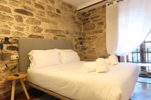 A bed or beds in a room at Sete Artes by Como en Casa