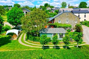 an aerial view of a house with a yard at La Vieille Forge in Houffalize