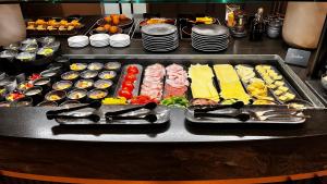 a buffet line with many different types of food at THE MATTHEW - Copper Lodge in Wagrain