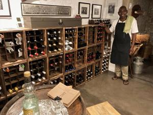 a man standing in front of a wine cellar at Torburnlea Homestead Luxury Accommodation in Nelspruit +90 photos
