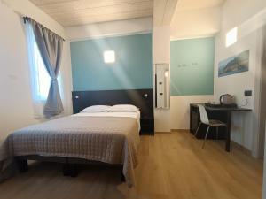 Postel nebo postele na pokoji v ubytování Il B&B di PIAZZA MOTTA