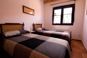 Katil atau katil-katil dalam bilik di La Cochera de Don Paco