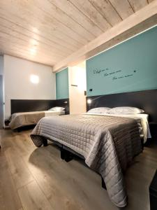 Postel nebo postele na pokoji v ubytování Il B&B di PIAZZA MOTTA