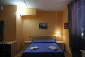 Posteľ alebo postele v izbe v ubytovaní Hotel Cordova