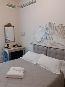 Postel nebo postele na pokoji v ubytování L'Angelo Blu