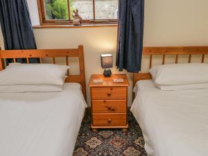Postelja oz. postelje v sobi nastanitve Wheelhouse Cottage