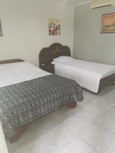 Кровать или кровати в номере Hotel Vale's
