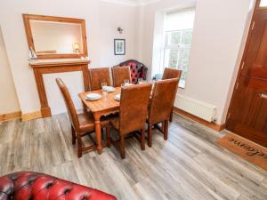 a dining room with a table and chairs at Rock House in Haverfordwest +20 photos