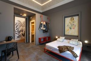 a bedroom with a bed with a leopard on it at 81 Suite and Breakfast in Catania