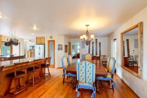 a dining room and kitchen with a table and chairs at Alder Lake View Lodge in Bass Lake