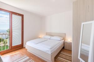 Posteľ alebo postele v izbe v ubytovaní Apartments Mrs Brightside