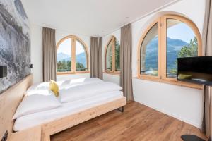 Rúm í herbergi á Berghotel Randolins
