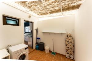 a laundry room with a washer and dryer at villa del mar puerto del carmen in Puerto del Carmen +24 photos
