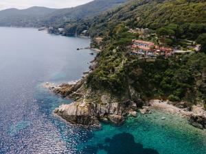 an aerial view of a village on a rocky island in the water at Residence Intur in Marciana Marina