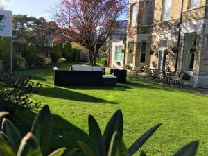 a lawn in front of a house at Applewood Hotel in Bournemouth