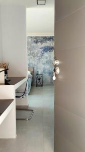 a room with a door leading to a bedroom at 3B Aurora - Bed Breakfast and Boat in Salerno