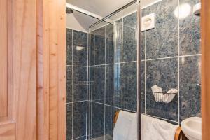 a shower with a glass door in a bathroom at Pheasants Lodge by Bloom Stays in Canterbury +15 photos
