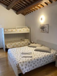 Postel nebo postele na pokoji v ubytování Agriturismo Da Andreina