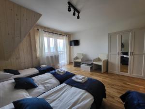 Posteľ alebo postele v izbe v ubytovaní Apartament z widokiem na panoramę Tatr "AppWidokowa9"