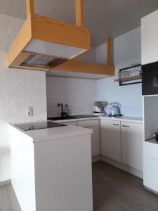 Kuchyň nebo kuchyňský kout v ubytování Zeezicht Falcon