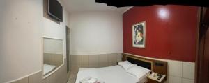 En eller flere senger på et rom på Hotel Smart Inn
